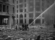 Asisbiz 16 Firemen spray water on damaged buildings London Sep 9 1940 01