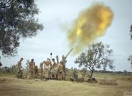 Asisbiz British desert forces 4.5 inch gun fires on a target Tunisia IWM TR1004