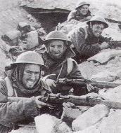 Asisbiz British infantry soldiers laughing as they wear their winter woolens in a desert North Africa 01