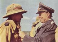 Asisbiz German Cmd Generalleutnant Hans Geisler handing out a medal to a Afrika Korps soldier 01