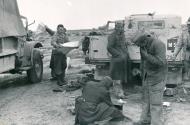 Asisbiz German DAK Afrika Korps recon unit advancing into Libya stop to inspect abandoned British vehicles ebay 02