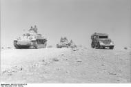 Asisbiz German armor DAK Panzer PzKpfw III convoy with military vehicles PKW on desert road Mar May 194 Bund