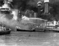 Asisbiz Fighting fires on the sunken battleship West Virginia (BB 48) Pearl Harbor 7th Dec 1941 80 G 19947