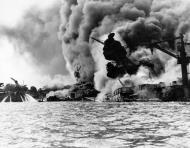 Asisbiz USS Arizona (BB 39) forward superstructure ablaze after her forward magazines exploded Pearl Harbor Attack 7th Dec 1941 80 G 19942