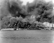 Asisbiz USS Arizona (BB 39) is sunk and burning with USS West Virginia (BB 48) sunk alongside USS Tennessee (BB 43) 80 G 33035