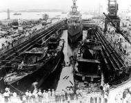 Asisbiz USS Cassin (DD 372) left and USS Downes (DD 375) under salvage in Drydock One Pearl Harbor 23rd Jan 1942 NH 54564