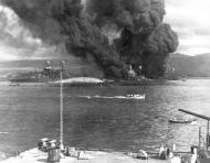 Asisbiz USS Oklahoma (BB 37) and the USS Maryland (BB 46) capsized after the Japanese attack on Pearl Harbor 7th Dec 1941 80 G 32691