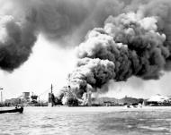 Asisbiz USS Shaw (DD 373) burning in floating drydock YFD 2 shortly after the explosion that blew off her bow 7th Dec 1941 80 G 32719