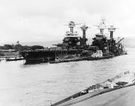 Asisbiz USS Tennessee (BB 43) at left alongside the sunken USS West Virginia (BB 48) Pearl Harbor 10th Dec 1941 NH 50770