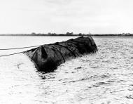 Asisbiz USS Utah (AG 16) as seen from the stern of USS Raleigh (CL 7) after Pearl Harbor Attack on 12 Dec 1941 NH 64498