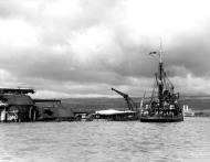 Asisbiz USS Widgeon (ASR 1) alongside the stern of the sunken USS Arizona (BB 39) Oahu Pearl Harbor Attack 7th Dec 1941 80 G 32761