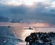 Asisbiz A destroyer passes astern of USS Ranger (CV 4) after the first day of landings sunset 8th Nov 1942 80 G 30232