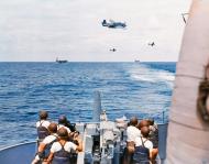 Asisbiz USS Dallas (DD 199) being over flown by Grumman TBF Avengers during Operation Torch Nov 1942 S 487 C 001