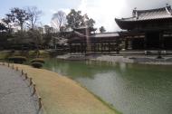 Asisbiz Byodo in temple outer path Phoenix Hall Jodo shiki garden pond Kyoto Japan 01