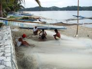 Asisbiz Philippines Tabinay fishermen repairing nets Varadero Bay 01