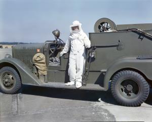 Asisbiz Fire Fighting unit in a Asbestos Suit with a US Army Mack Class 125 airfield crash truck 1942 02