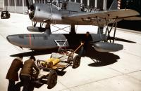 Asisbiz Vought OS2U 3 Kingfisher Being loaded with a pair of yellow practice bombs at a naval air station circa early 1942