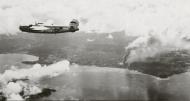 Asisbiz 44 41419 B 24L Liberator 13AF 307BG370BS over Borneo after hitting the Jesselton airfield 13th Mar 1945 02