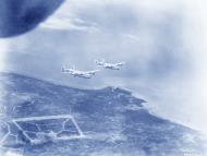 Asisbiz 5AF 43BG65BS B 24 Liberators after bombing Dobodura airstrip Papua New Guinea 1943 NA864