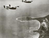 Asisbiz Consolidated B 24D Liberators 5AF 43BG63BS bomb the Boram airstrip at Wewak New Guinea 18th Feb 1944 01