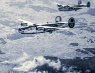 Asisbiz Consolidated B 24 Liberators 15AF 460BG leaving the smoldering railyards at Gmund Austria 23rd Mar 1945 01