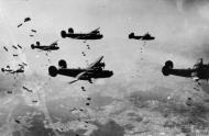 Asisbiz Target B 24 Liberators 467th Bomb Group dropping their bomb loads over the drop zone FRE8474