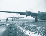 Asisbiz Consolidated B 24 Liberator 11AF 28BG landing in a snow storm after a raid Aleutian Islands 1943 NA1043