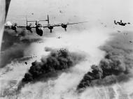 Asisbiz 15th Air Force B 24s fly through flak and over the destruction created by preceding waves of bombers