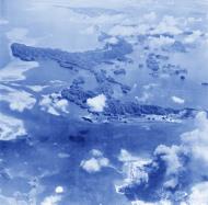 Asisbiz USN Target Palau Island hitting numerous buildings and ships 30th Mar 1944 NA088