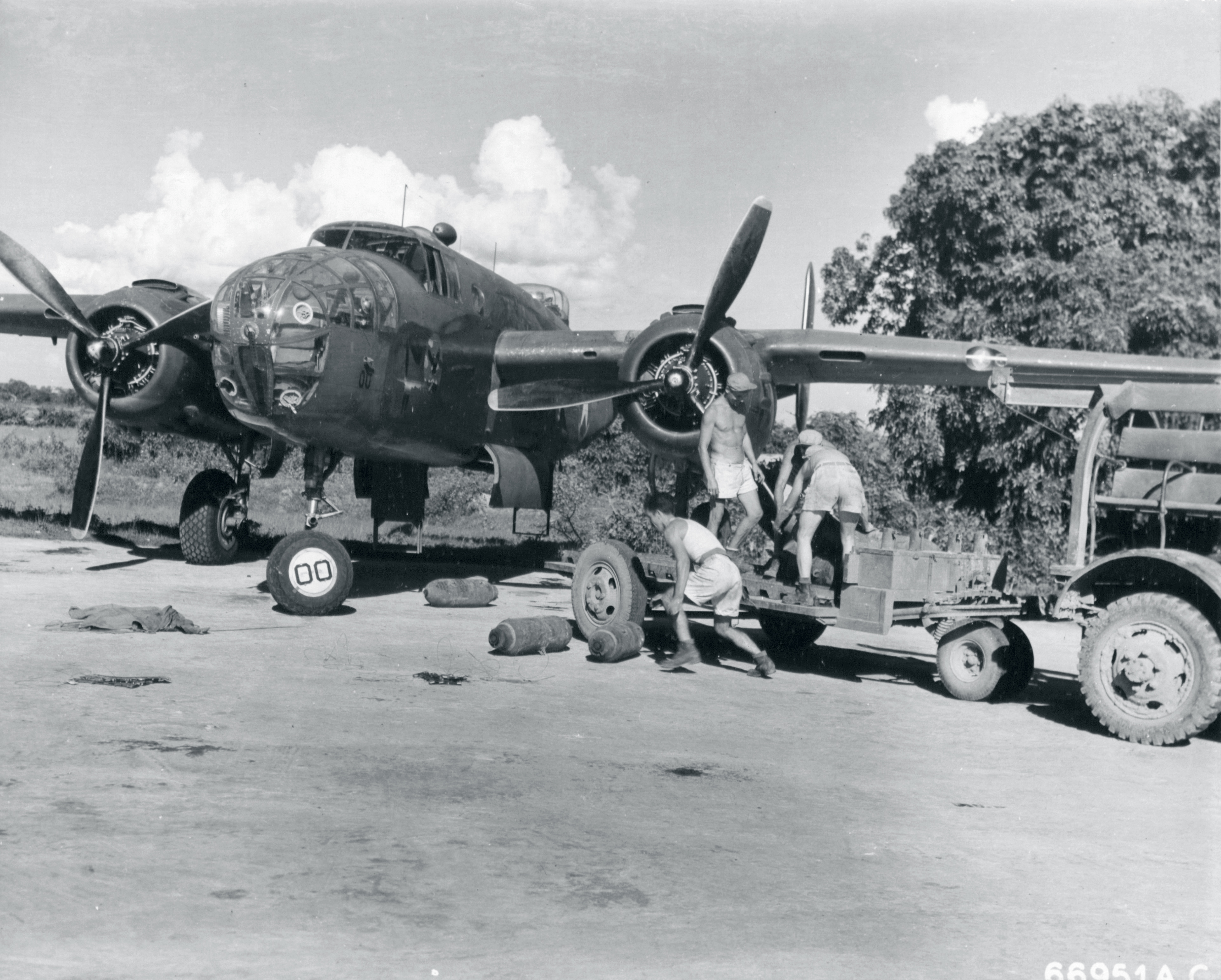 Asisbiz 10AF 341BG armaments crew prepare the aircraft for their next ...