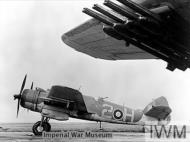 Asisbiz Beaufighter TFX RCAF 404Sqn 2H NE355 fully loaded with rocket projectiles at Davidstow Moor Cornwall IWM MH7465