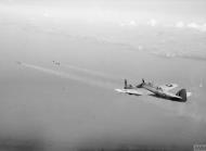 Asisbiz Beaufighter TFX RCAF 404Sqn 2R based at Davidstow Moor Cornwall firing a pair of 3 inch rocket projectiles IWM CH13183