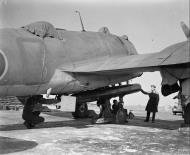 Asisbiz Beaufighter VI RAF 144Sqn being fitted with an 18in Mk XV torpedo IWM CH9769