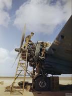 Asisbiz Beaufighter IC RAF 252Sqn under repair note patched over 303 wing gun ports at El Magrun Libya IWM TR901