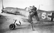 Asisbiz Messerschmitt Bf 109E7 10.JG1 White 5 ground crew assisting George Schott with his straps 01