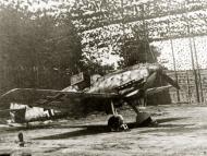 Asisbiz Messerschmitt Bf 109E7 IV.JG1 under netting 01