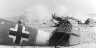 Asisbiz Messerschmitt Bf 109E7Trop 1.JG27 White 1 Wolfgang Redlich rudder 1941 01