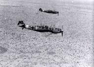 Asisbiz Messerschmitt Bf 109E7Trop 1.JG27 White 3 and 8 on low level patrol over Libya Feb 1942 04