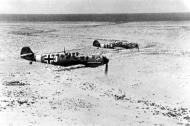 Asisbiz Messerschmitt Bf 109E7Trop 1.JG27 White 3 and 8 on low level patrol over Libya Feb 1942 05