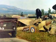 Asisbiz German Blenheim graveyard showing various parts with RAF 21Sqn YH background 01