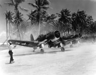 Asisbiz Vought F4U 1A D Corsair take off in a dust storm armed with 500lb bombs on Majuro Atoll Marshall Islands Aug 1944 80 G 425529