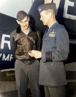 Asisbiz VMF 214 Black Sheep Maj William M Lundin making Capt Jimmy Thatch skipper of USS Sicily a honorary member 31st Jan 1951 NARA 01