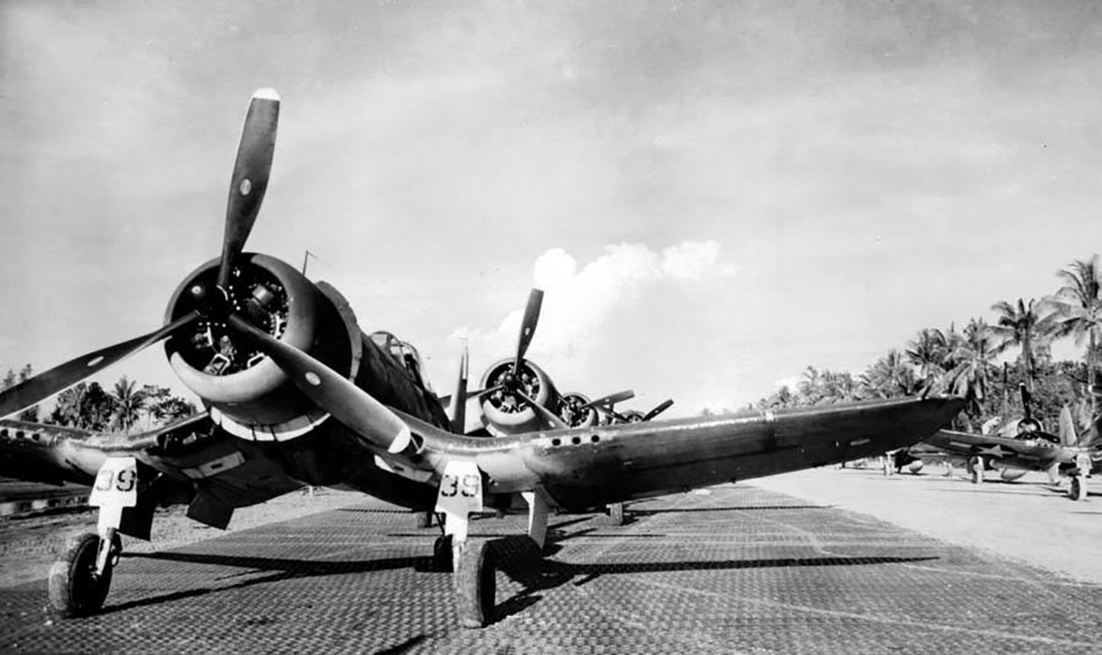 Asisbiz Vought F4U-1A Corsairs VMF 216 White 39 and 123 parked at