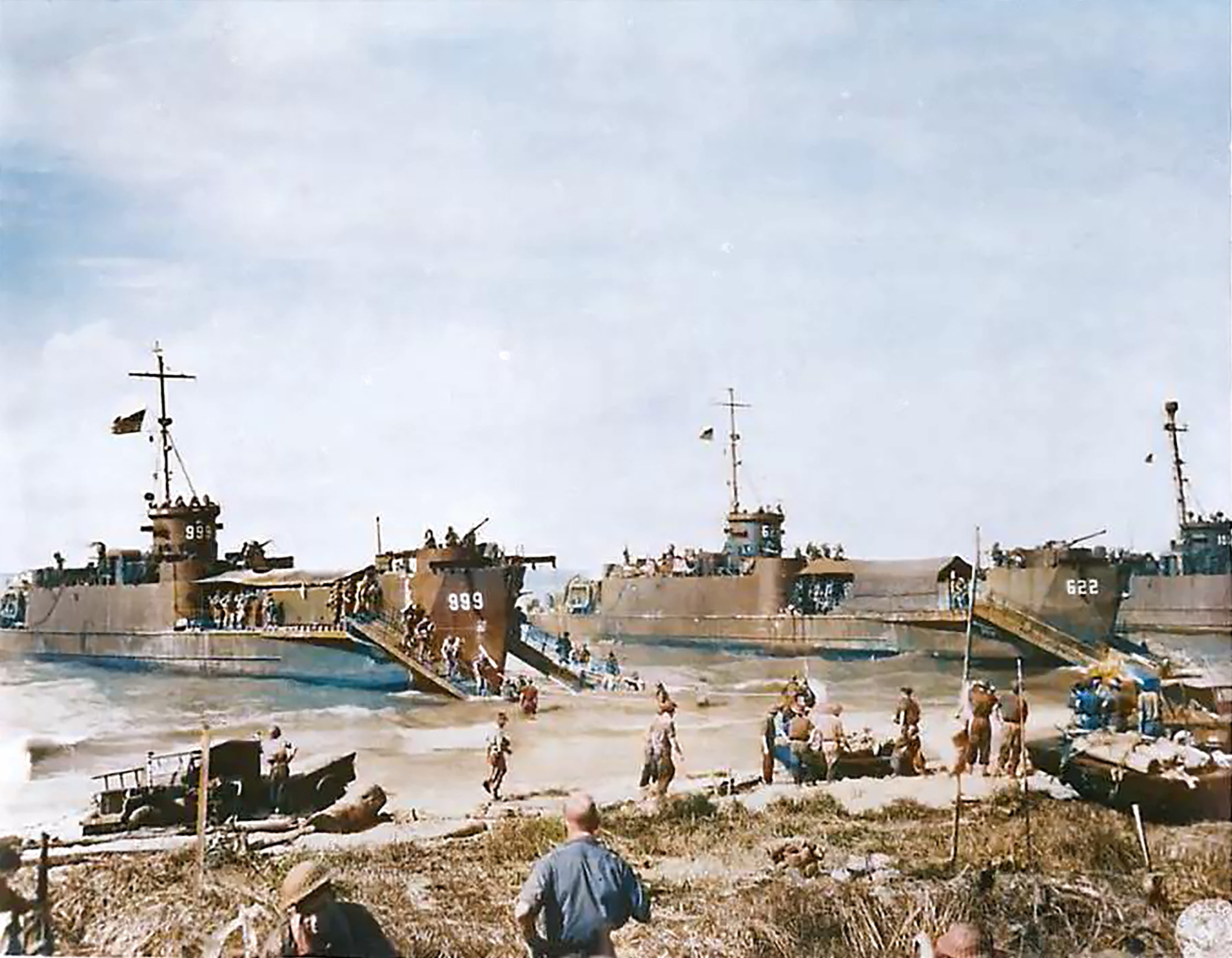 7th Division Australian troops come ashore from landing craft during a landing near Balikpapan oil fields in Borneo