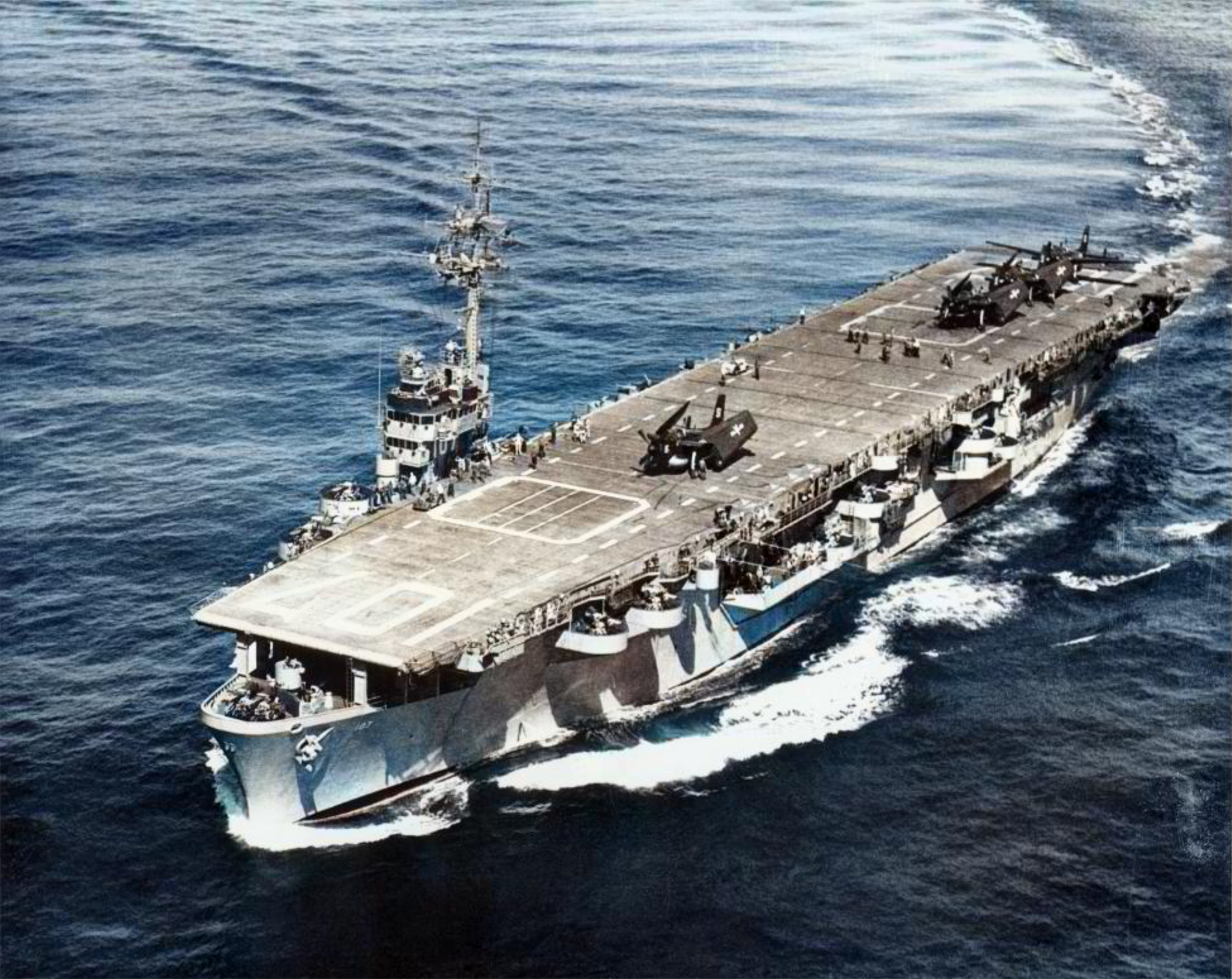 USS Gilbert Islands (CVE 107) underway in the early 1950s with AF Guardian aircraft from VS 24 squadron on deck 01