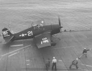 Asisbiz Grumman F6F 5N Hellcat MCVG 1 White WF21 preparing for launch 01