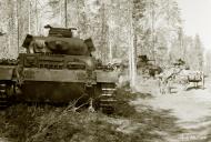 Asisbiz German Panzer III tanks moving to the front lines Vasonvaara 1st Jul 1941 22909
