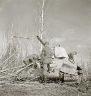 Asisbiz Soviet T34 tank knocked out by a mine near Syvari power plant 19th Apr 1942 83977