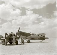 Asisbiz Curtiss Tomahawk IIb RAF 107MU AKxxx being refuelled at an airfield in the Canal Zone Egypt IWM E2676E
