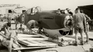 Asisbiz Curtiss Tomahawk IIb RAF 107MU RAF Fitters uncrate the fuselage section at Kasfareet Egypt IWM CM1096a